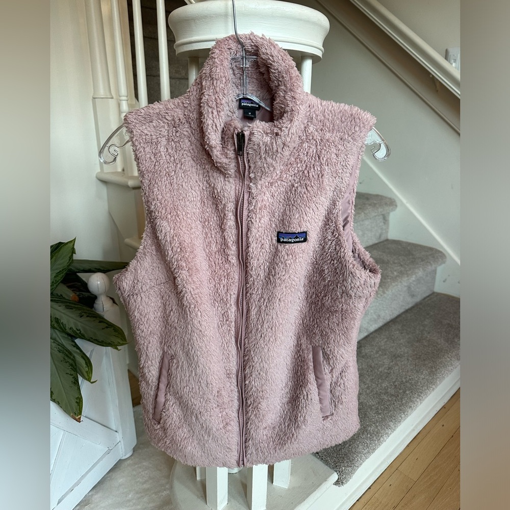 Blush vest purchased and never worn. Runs small.